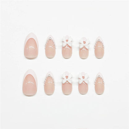 24Pcs Almond Press on Nails French Tips Short Fake Nails with Cute Bow Charms Design French Press on False Nails Nude Pink Acrylic Nails Almond Shaped Artificial Nails for Women Girls Manicure Tip